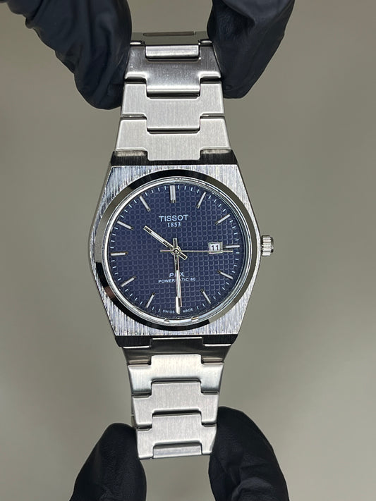 Tissot with blue dial and silver chain