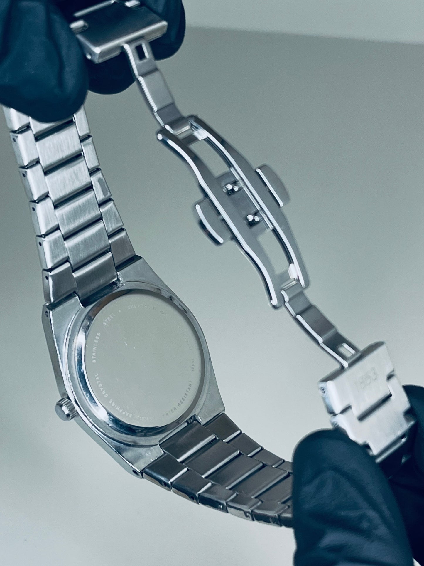 Tissot with blue dial and silver chain