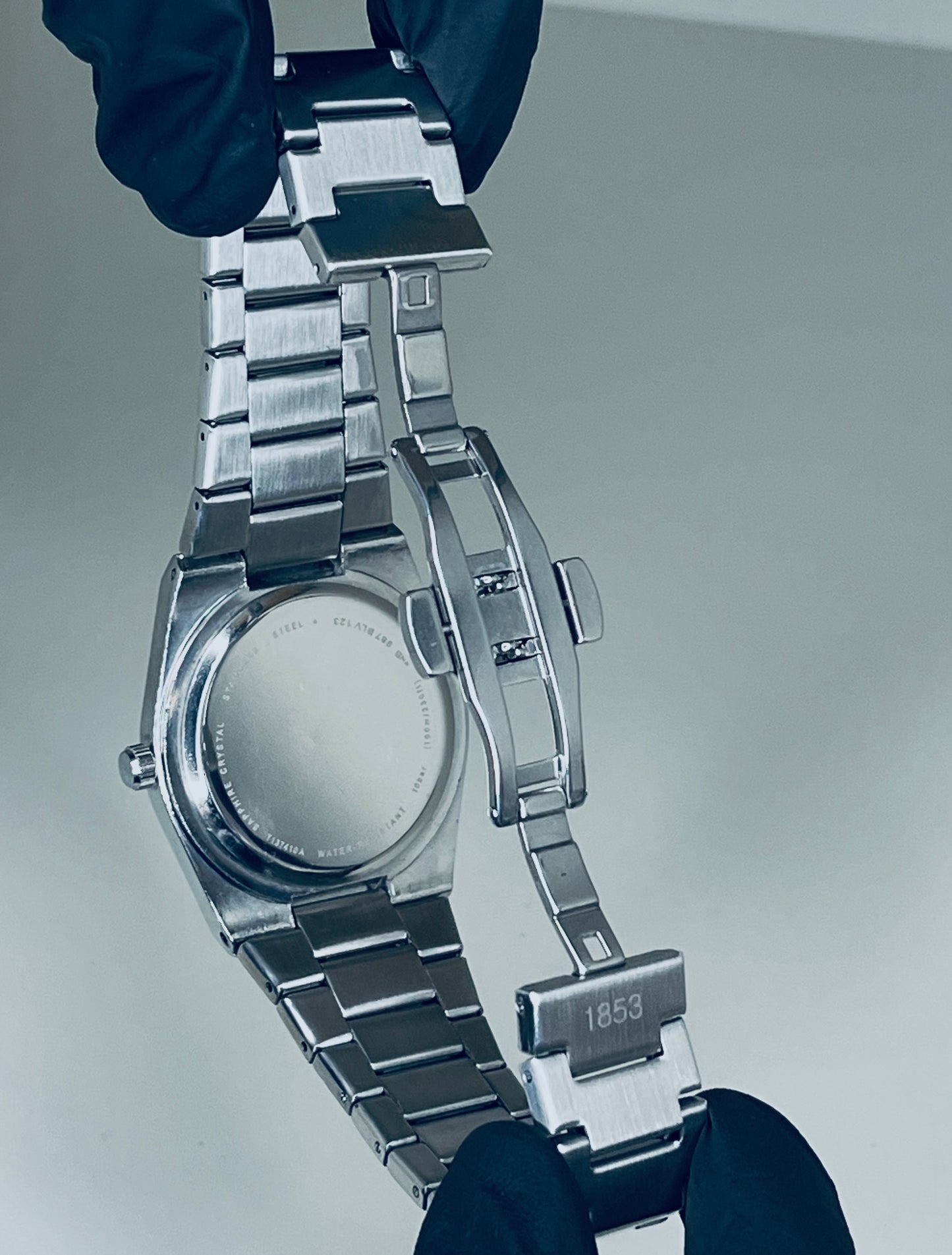 Tissot with blue dial and silver chain
